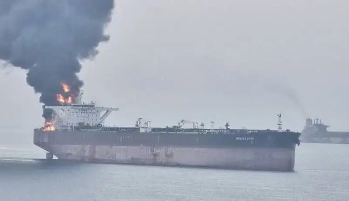 An oil tanker caught fire in the Gulf of Oman, forcing over 50 merchant ships to change their routes